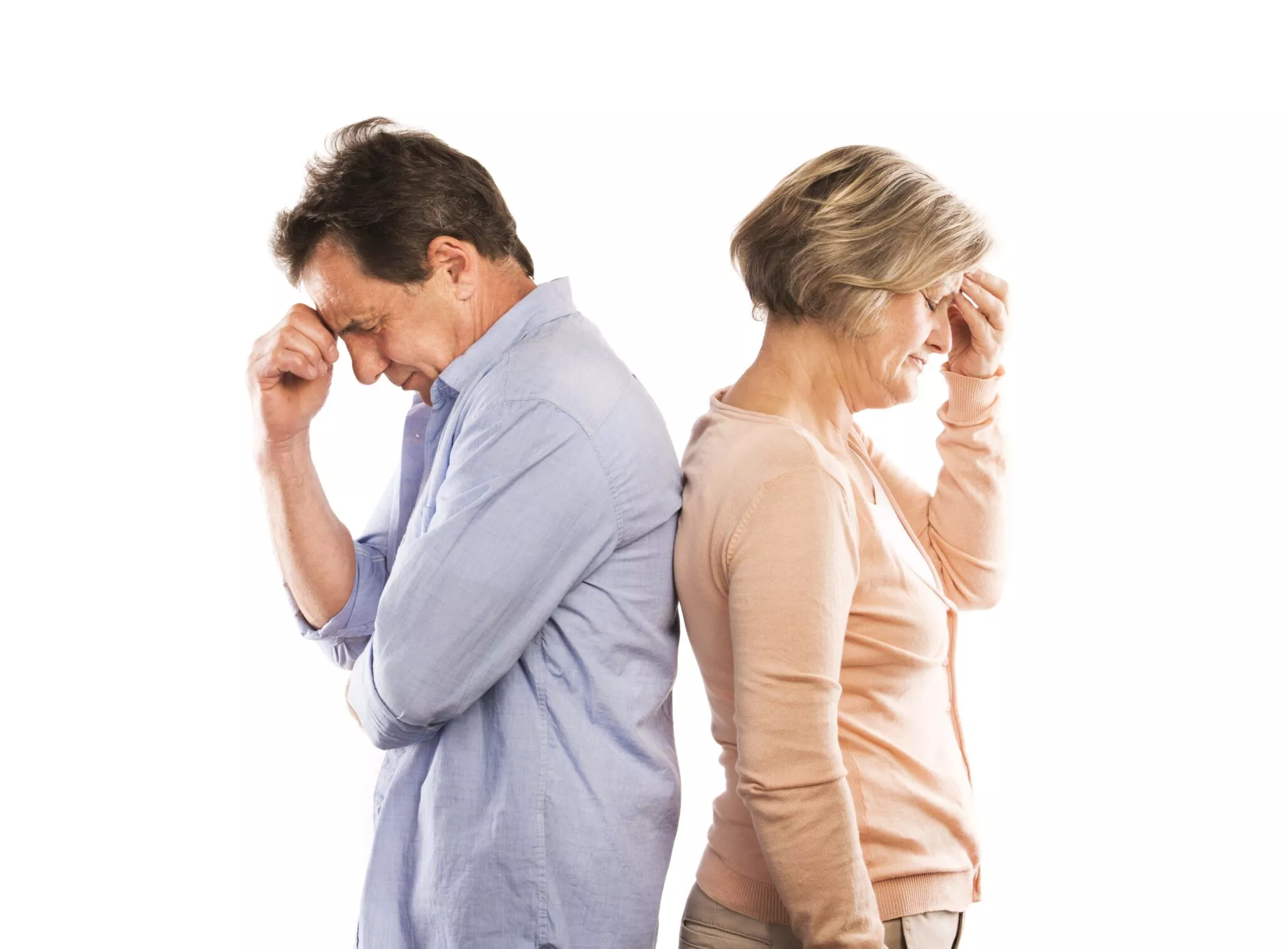 Middle-aged man and woman standing back to back with distressed expressions, symbolizing family conflict relevant to Nussbaum family lawyers in Toronto.