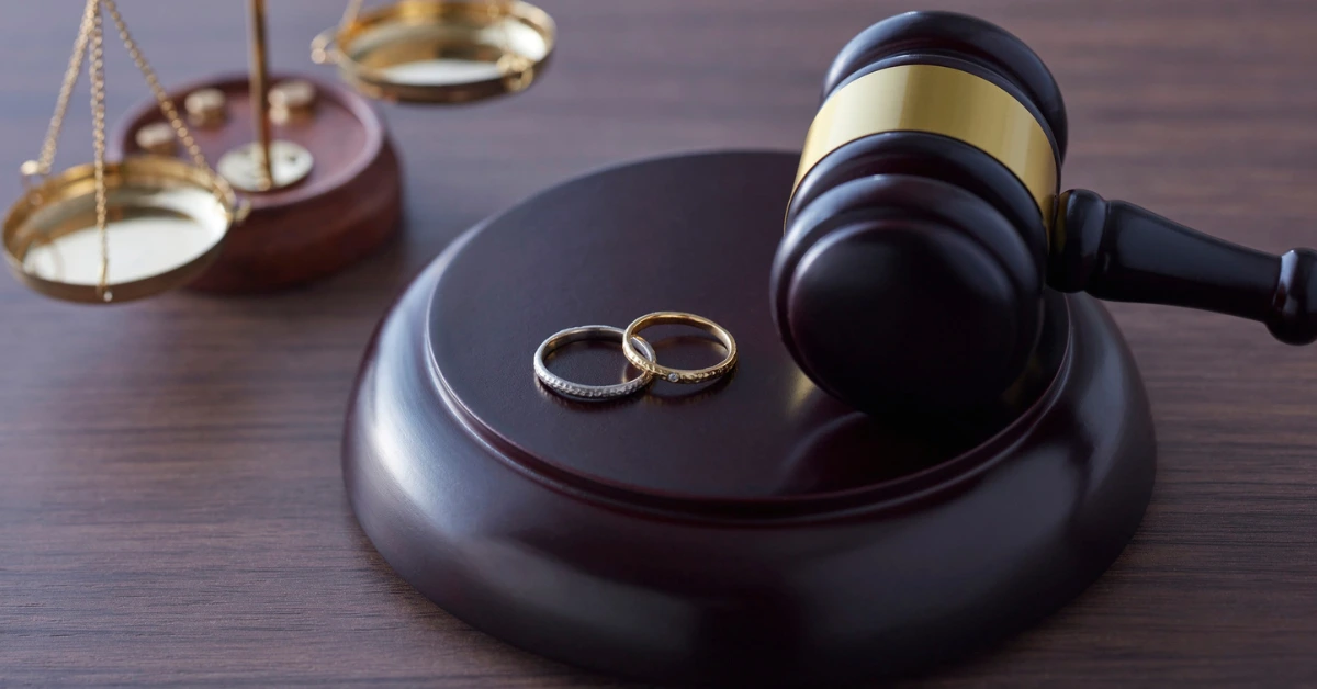 Wedding Rings Over a Judge Mace Representing a Divorce